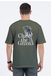 Model wearing olive green oversized men’s t-shirt – back view of “Chase the Green” graphic streetwear tee