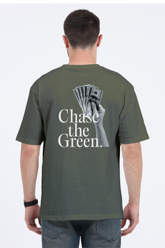 Model wearing olive green oversized men’s t-shirt – back view of “Chase the Green” graphic streetwear tee