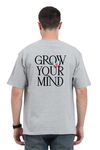 Model wearing grey oversized men’s t-shirt – “Grow Your Mind” graphic back print streetwear tee