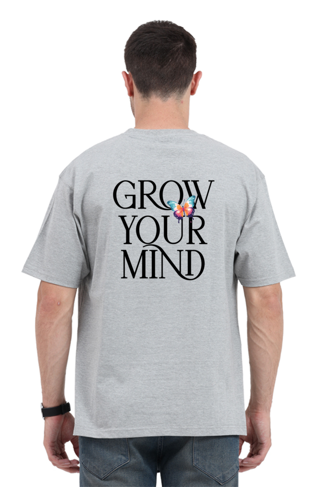 Model wearing grey oversized men’s t-shirt – “Grow Your Mind” graphic back print streetwear tee