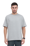 Model wearing grey oversized men’s cotton t-shirt – minimal front streetwear style