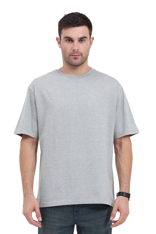 Model wearing grey oversized men’s cotton t-shirt – minimal front streetwear style