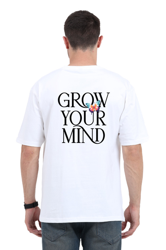 Model wearing white oversized men’s t-shirt – “Grow Your Mind” graphic back print streetwear design