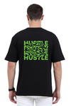 Model wearing black oversized men’s t-shirt – back view of Hustle graphic cotton streetwear tee