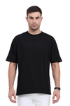 Model wearing black oversized men’s t-shirt – “Hustle” printed cotton streetwear front view